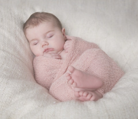 Wrapped newborn baby girl photography by your first choice photographer Jayne Poole located in Great Torringotn near Bideford, Barnstaple, Fremiongton, South Molton, Holsworthy, Bude for professional images of your child