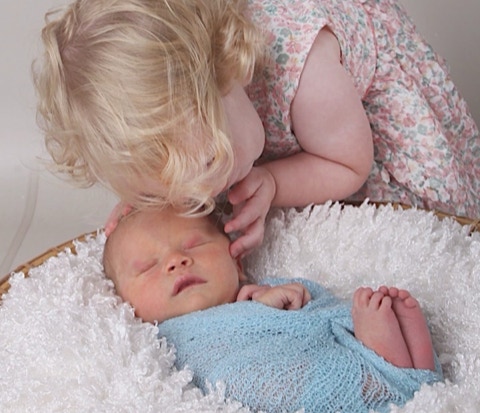 Newborn baby photographer by Jayne Poole with sister in North Devon, near to me, Bideford, Barnstaple, South Molton, Roundswell, Fremington, Northam, Appledore, Instow, Clovelly, and Bude.